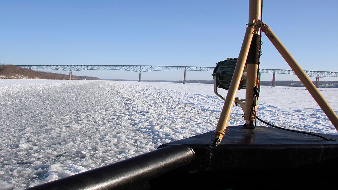 The U.S. Coast Guard cutter Sturgeon Bay breaks ice in the shipping channel on the Hudson River near the Kingston-Rhinecliff Bridge in Feb. 2015.