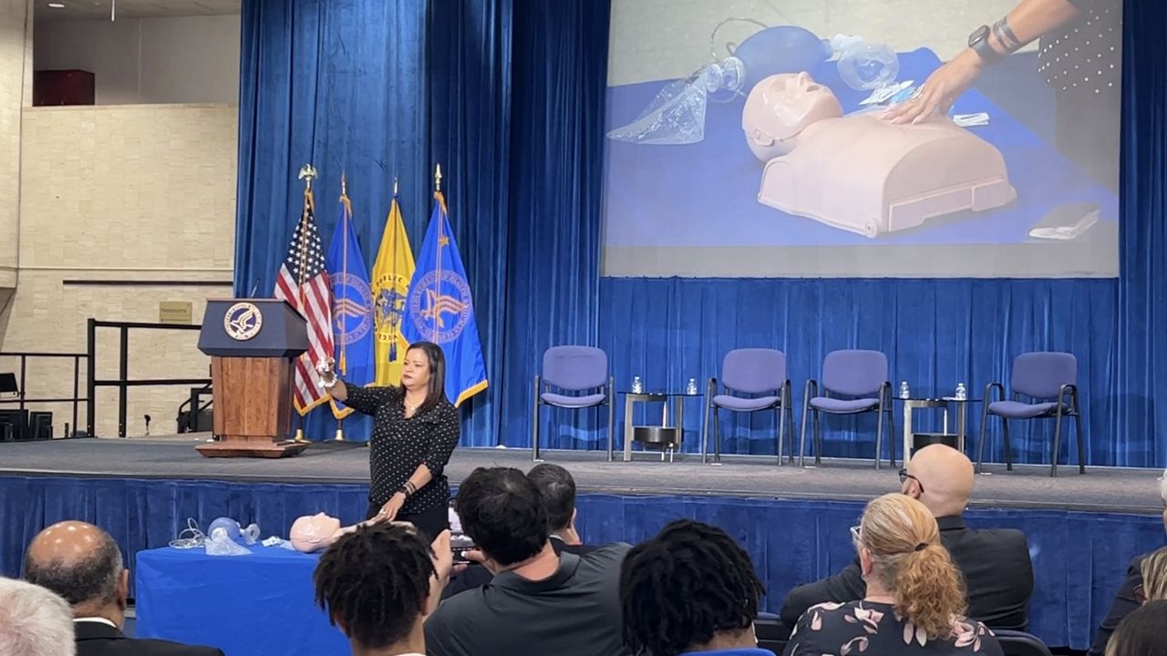 Rosalind Pichardo, founder of volunteer organization Operation Save Our City, demonstrates how to administer Narcan at an event on Sept. 8, 2023 at the Department of Health and Human Services in Washington, D.C. (Spectrum News)