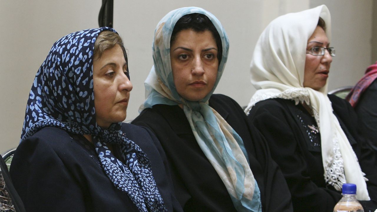 Prominent Iranian human rights activist Narges Mohammadi, center, sits next to Iranian Nobel Peace Prize laureate Shirin Ebadi, left, while attending a meeting on women's rights in Tehran, Iran, on Aug. 27, 2007. (AP Photo/Vahid Salemi, File) 