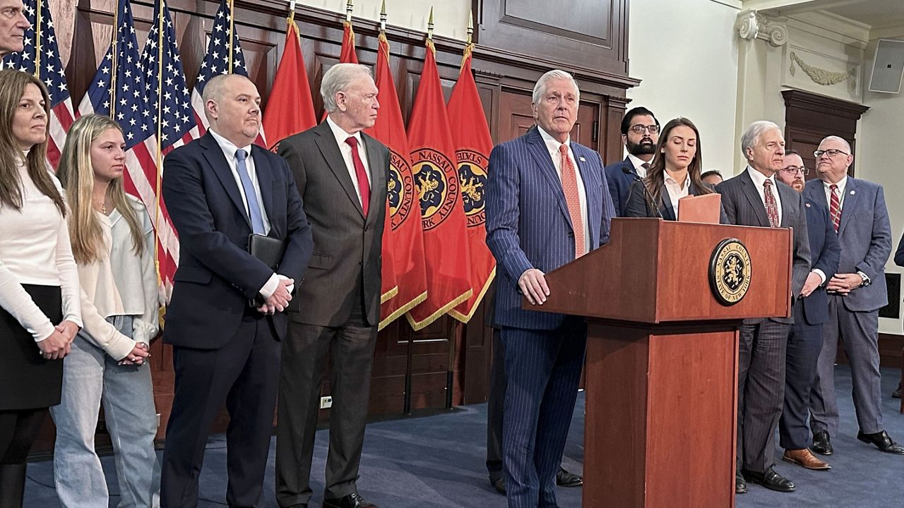 Nassau County Executive Bruce Blakeman, at podium, speaks during a news conference, March 6, 2024, in Mineola, N.Y. (AP Photo/Philip Marcelo, File)