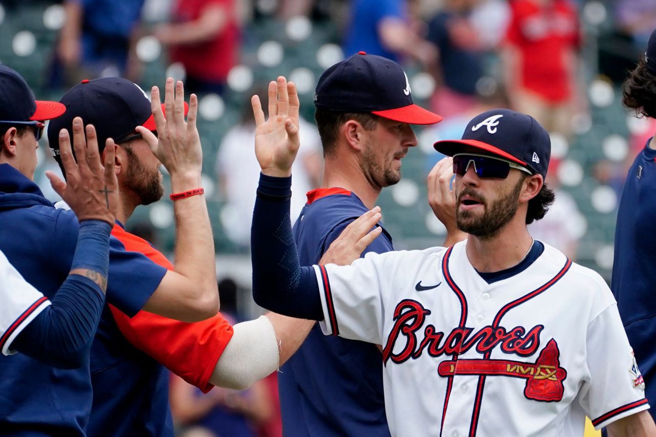 News Photo : Dansby Swanson of the Atlanta Braves watches the