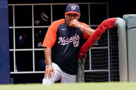 The Braves' Dansby Swanson high fives teammates prior to a game