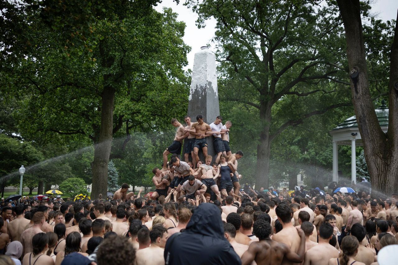 A greasy, monumental ritual at the Naval Academy ends after more than 2 ...