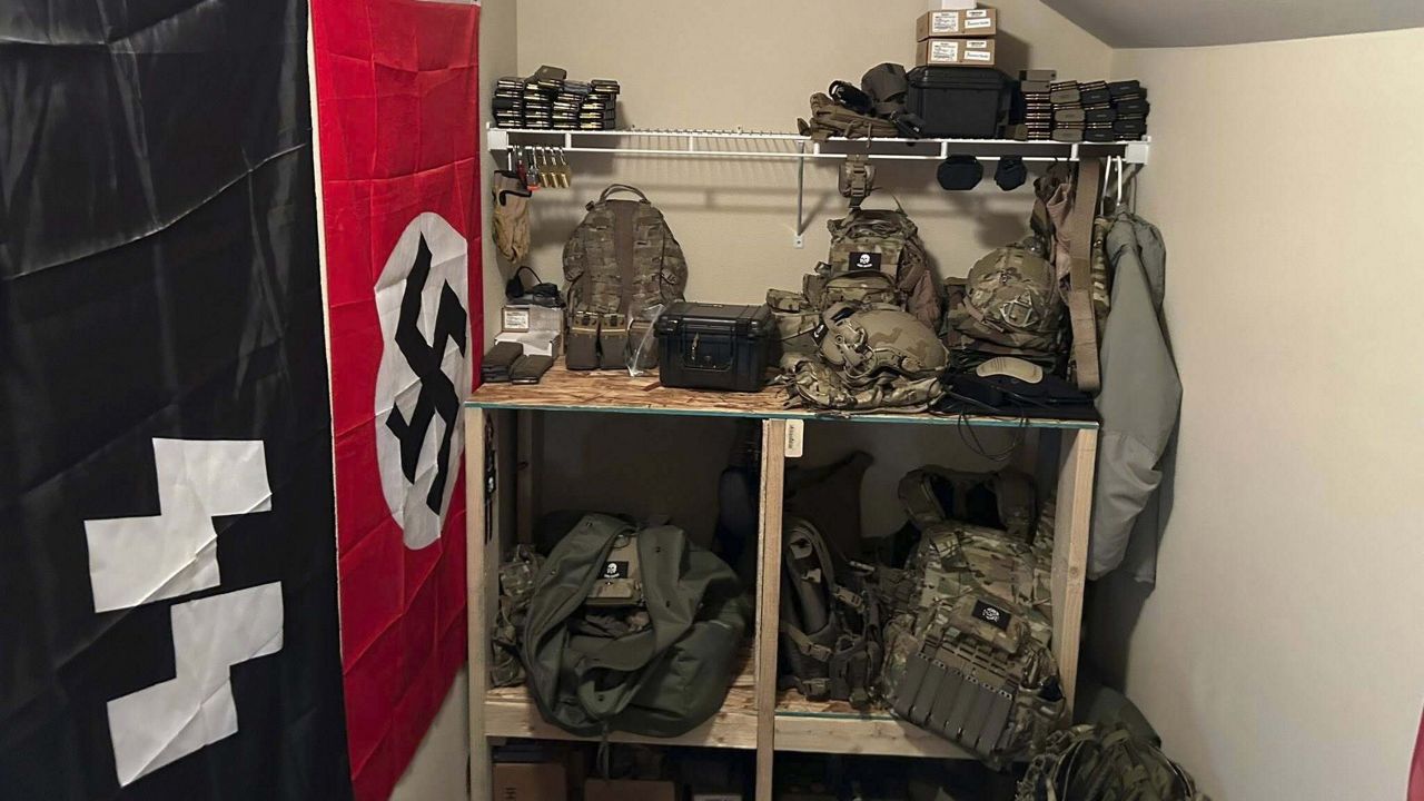 In this undated photo released by the Thurston County Sheriff's Office, a cache of military weaponry and Nazi paraphernalia are photographed during a raid at a home in Lacey, Wash. (Thurston County Sheriff's Office via AP)