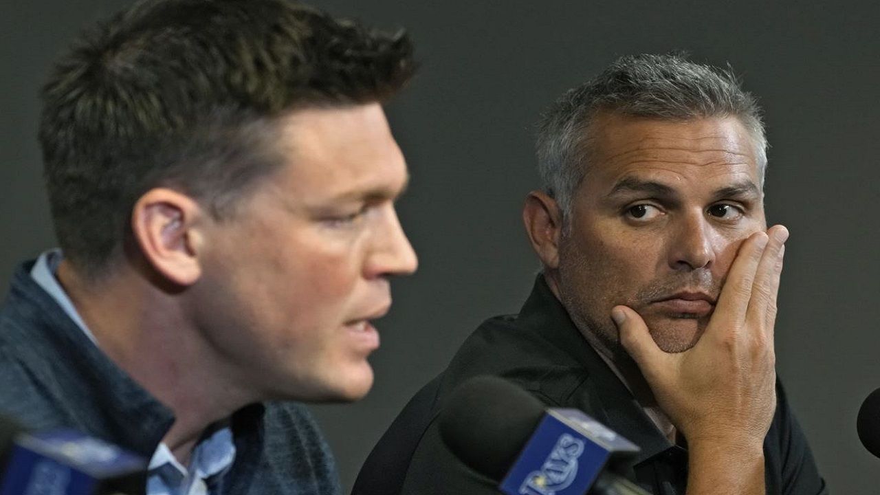 Tampa Bay Rays manager Kevin Cash (right) looks on as Erik Neander, president of baseball operations, speaks during last season's end-of-season news conference. (AP Photo/Chris O'Meara)