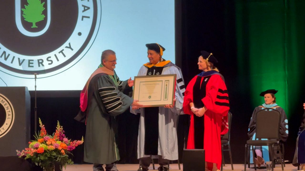 Neil deGrasse Tyson accepts an Honorary Doctorate in Sustainability Science from Unity Environmental University. (Spectrum News/David Ledford)