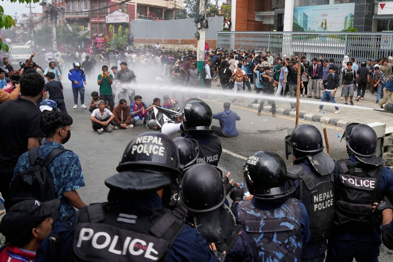 Protesters in Nepal surround parliament and clash with police as government  blocks social media