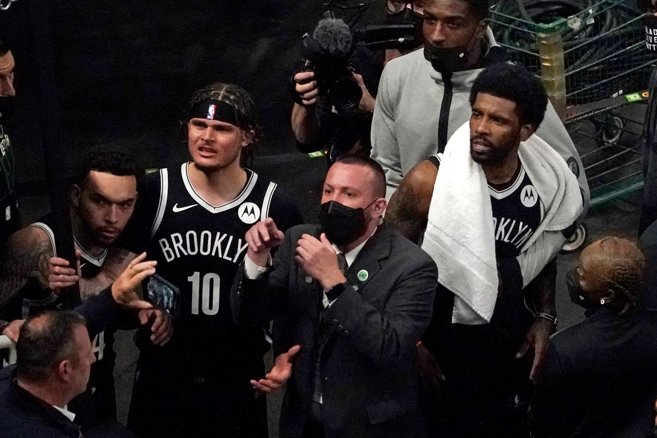 Fan at TD Garden detained, cuffed for throwing water bottle at Kyrie Irving  after Game 4