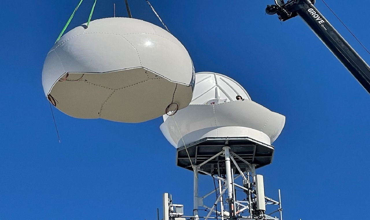 New radome hoisted to top of Klystron 9's tower