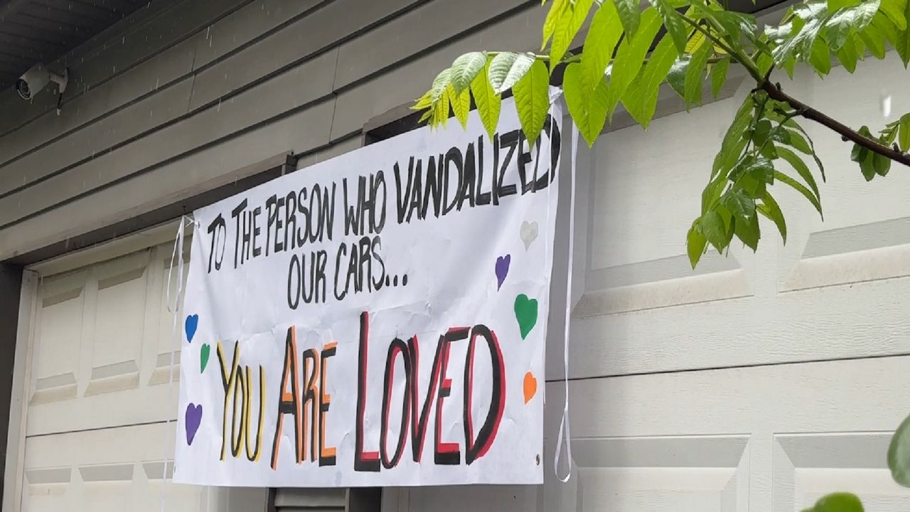 A Westerville family created a sign saying ‘You're loved’ to the person who vandalized their cars. (Spectrum News 1/Aliah Keller)
