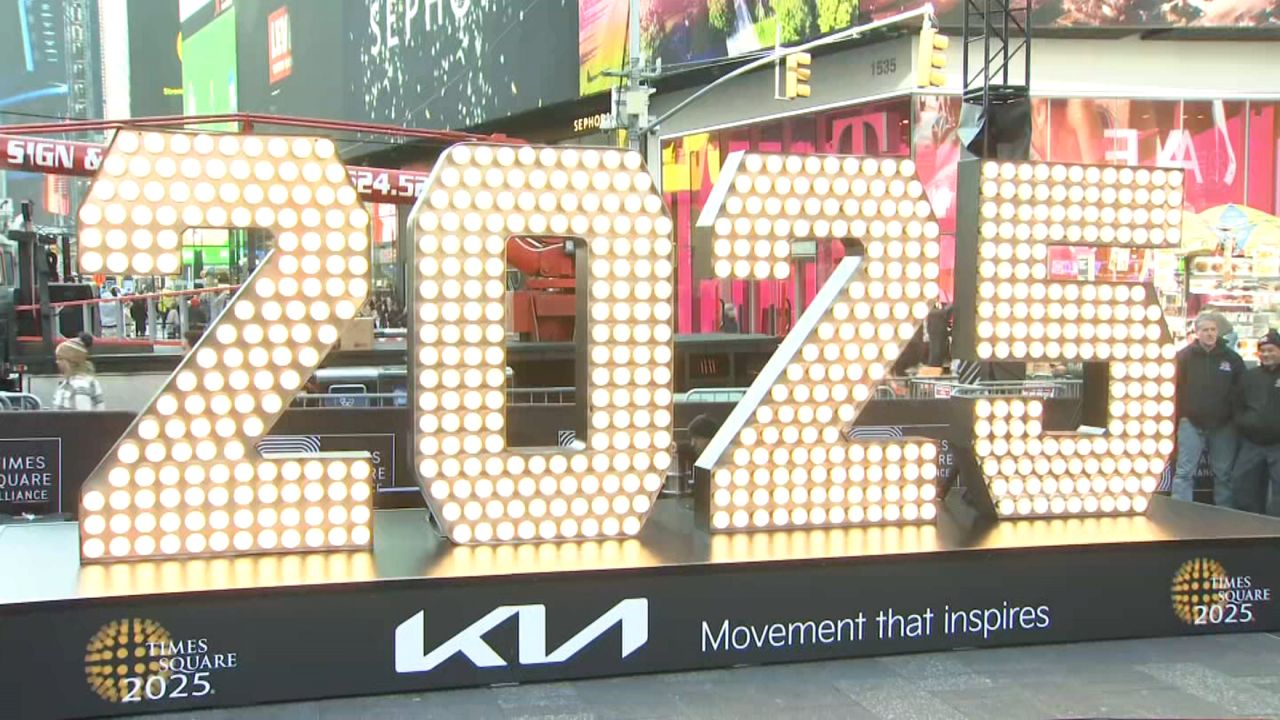 The numbers weigh around 1,200 pounds total, and there are 620 light bulbs across the four of them. (Spectrum News NY1)