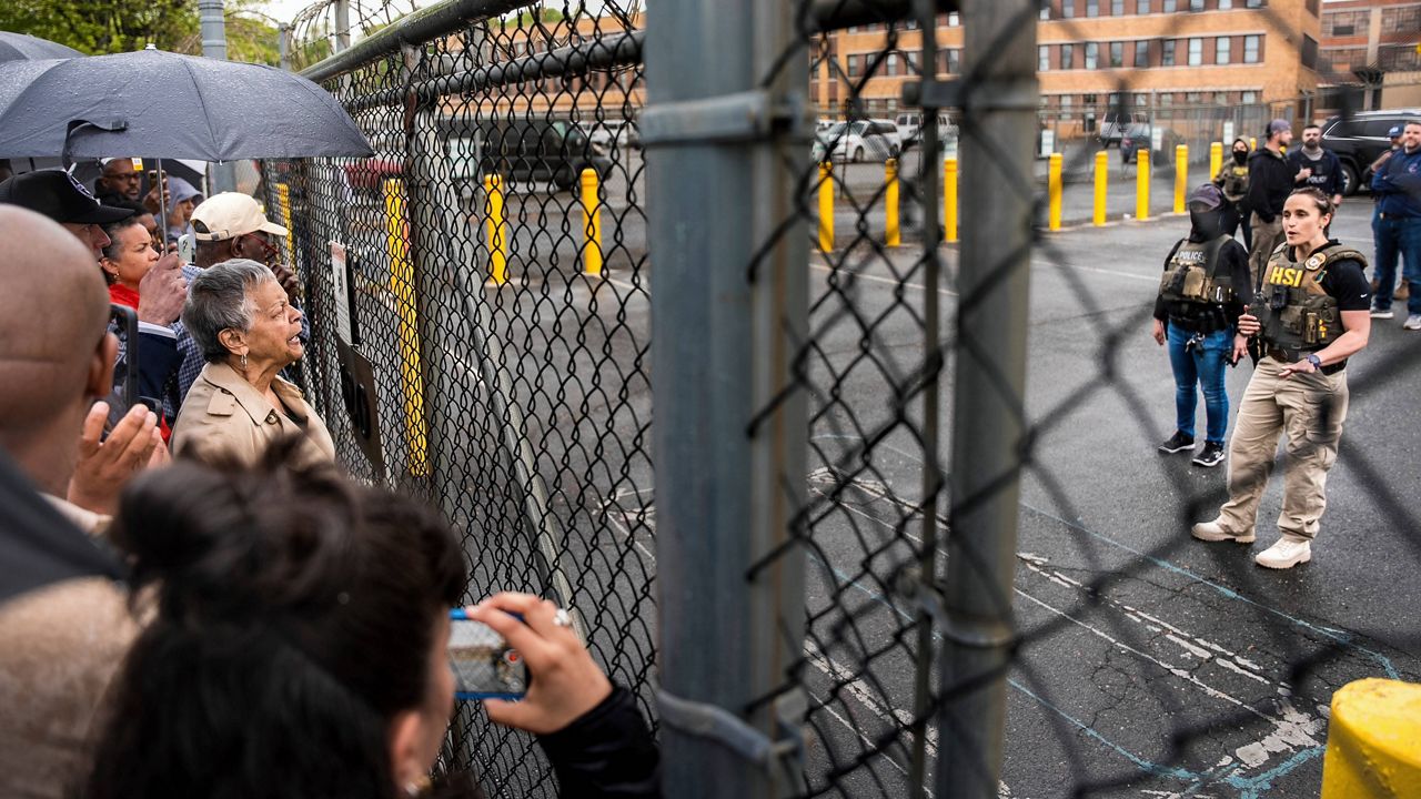 Rep. Bonnie Watson Coleman, D-N.J., speaks with an officer demanding she be let into the ICE Detention office after the arrest of Newark Mayor Ras Baraka, Friday, May 9, 2025, in Newark, N.J. (AP Photo/Angelina Katsanis)