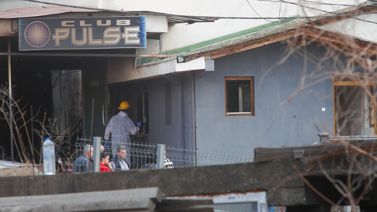 A firefighter inspects a nightclub after a massive fire in the town of Kocani, North Macedonia, Sunday, March 16, 2025. (AP Photo/Boris Grdanoski)