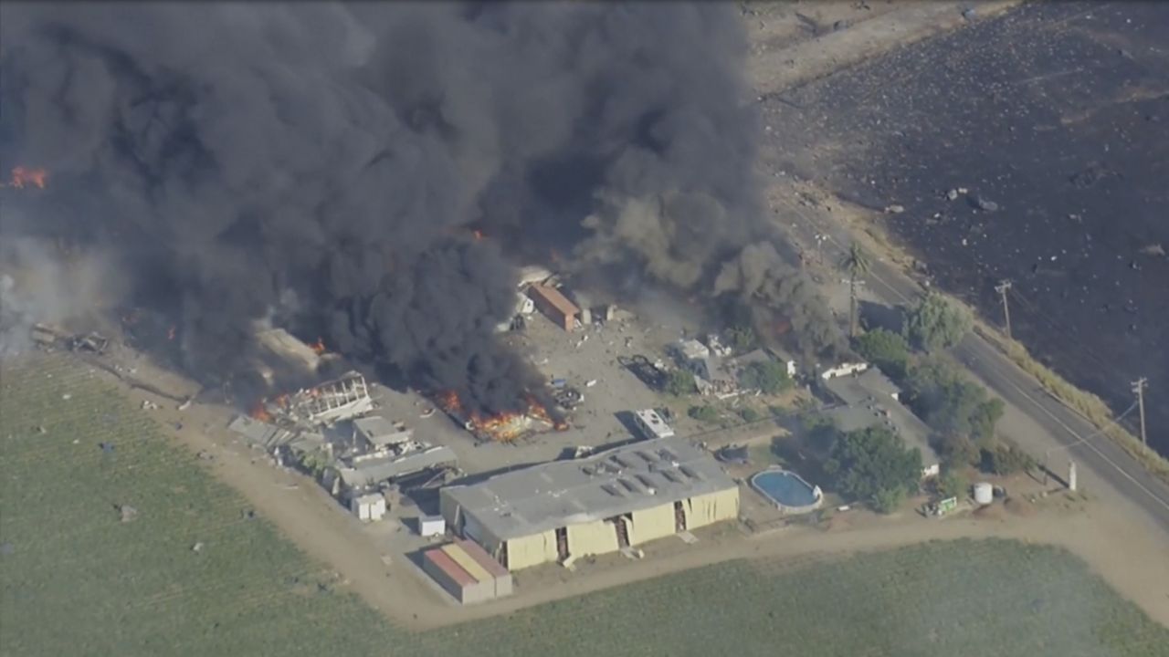 Smoke and flames rise at a fireworks warehouse near Esparto, Calif., on Tuesday, July 1, 2025. (KGO via AP)