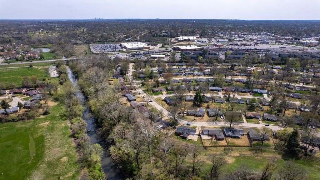 Coldwater Creek flows Friday, April 7, 2023, in Florissant, Mo. Coldwater Creek was contaminated decades ago when waste from nuclear bomb development was dumped into the creek. (AP Photo/Jeff Roberson, File)