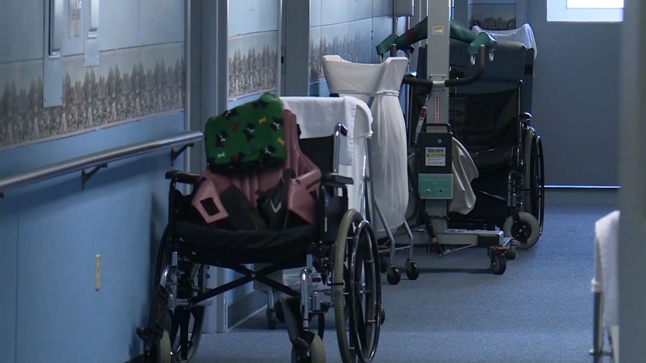 wheelchair in hall of nursing home