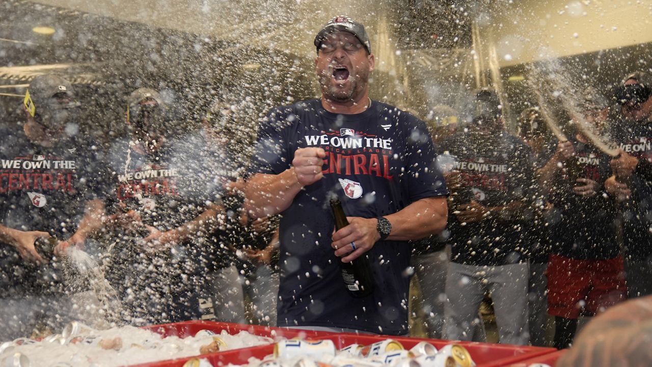 Cleveland Guardians manager Stephen Vogt celebrates in the clubhouse following a baseball game against the St. Louis Cardinals and winning the American League Central Saturday, Sept. 21, 2024, in St. Louis. (AP Photo/Jeff Roberson)