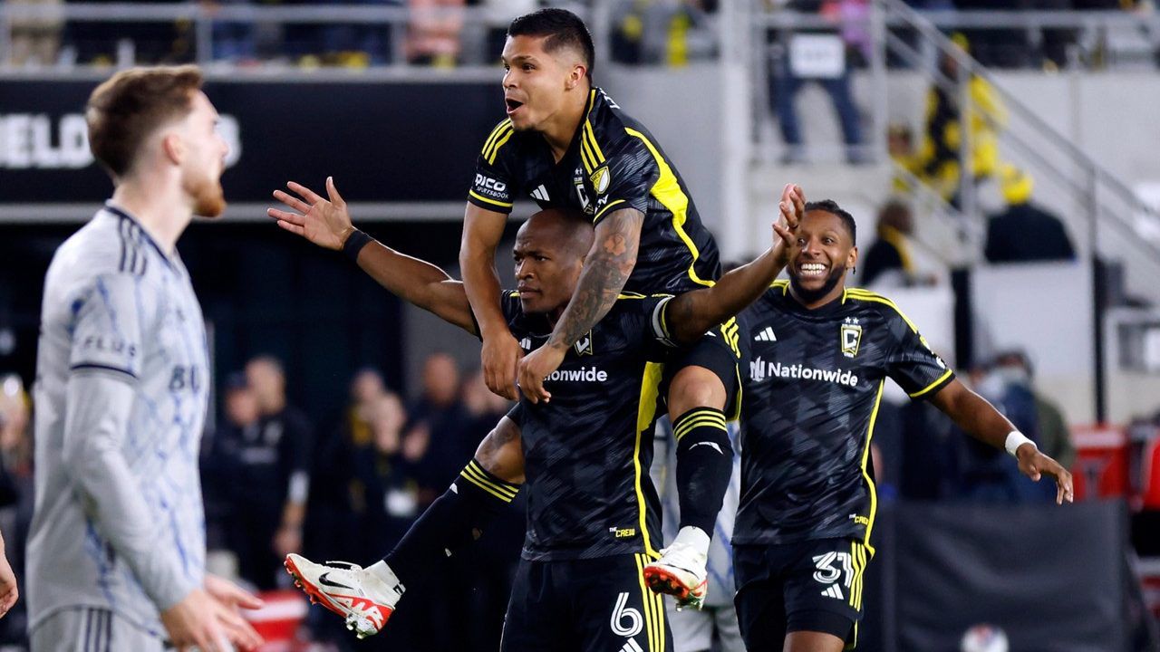 Columbus Crew midfielder Darlington Nagbe (6) celebrates his goal against CF Montreal with teammates forward Cucho Hernandez, top, and defender Steven Moreira (31) during the second half of an MLS soccer match in Columbus, Ohio, Saturday, Oct. 21, 2023. The Crew won 2-1. (AP Photo/Paul Vernon)