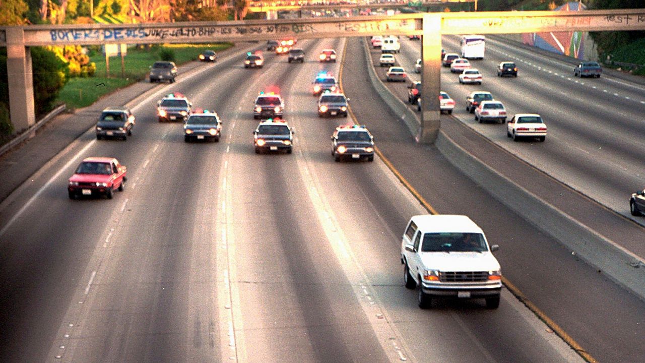 In this June 17, 1994, file photo, a white Ford Bronco, driven by Al Cowlings carrying O.J. Simpson, is trailed by Los Angeles police cars as it travels on a freeway in Los Angeles. (AP Photo/Joseph Villarin)
