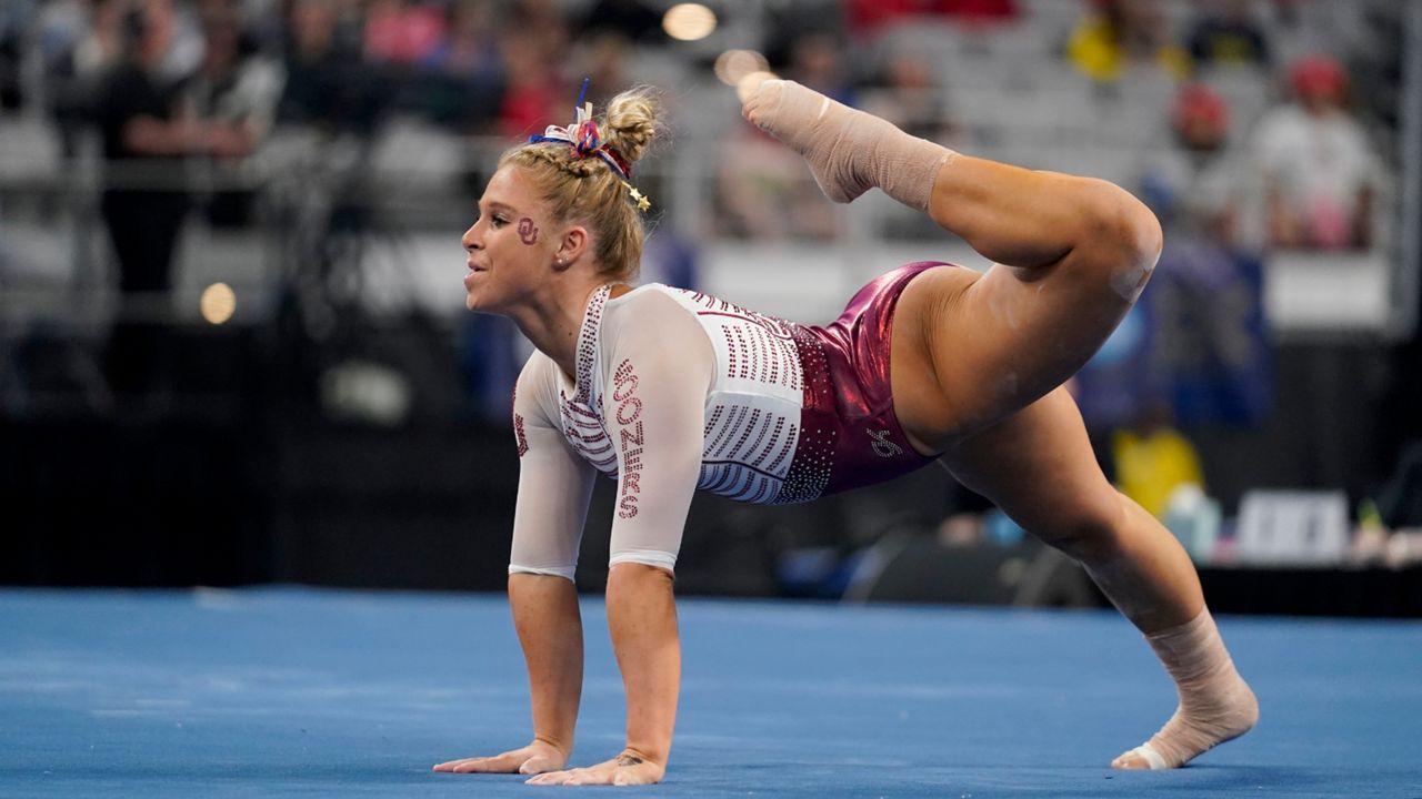 Oklahoma's Ragan Smith competes on the floor exercise during the NCAA women's gymnastics championships, Thursday, April 14, 2022, in Fort Worth, Texas. (AP Photo/Tony Gutierrez)