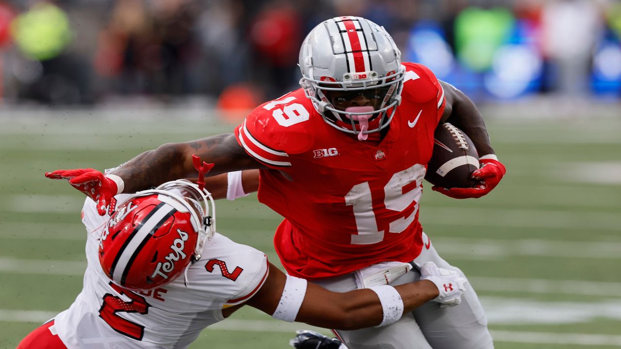 Ohio State running back Chip Trayanum, right, stiff arms Maryland defensive back Beau Brade during the first half of an NCAA college football game Saturday, Oct. 7, 2023, in Columbus, Ohio. (AP Photo/Jay LaPrete)