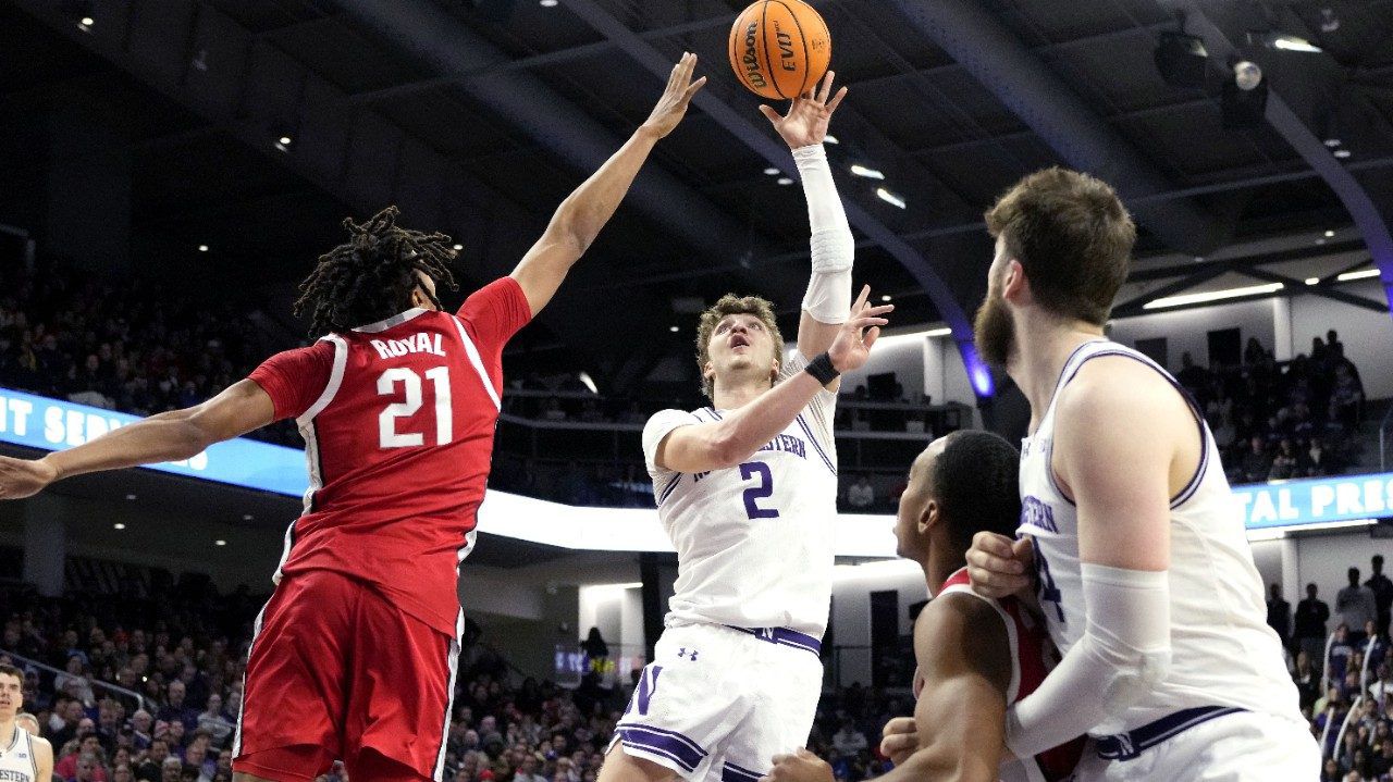 Northwestern forward Nick Martinelli (2) shoots over Ohio State forward Devin Royal (21) during the second half of an NCAA college basketball game in Evanston, Ill., Saturday, Jan. 27, 2024. (AP Photo/Nam Y. Huh)