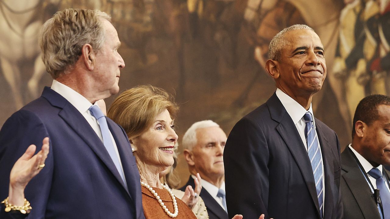 From left, former President George W. Bush, former first lady Laura Bush and former President Barack Obama, arrive before the 60th Presidential Inauguration in the Rotunda of the U.S. Capitol in Washington, Monday, Jan. 20, 2025. (Chip Somodevilla/Pool Photo via AP)