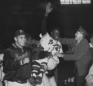 Atlanta Braves' Hank Aaron hits his 715th homerun, April 8, 1974. A crowd  of 53,775 people, the largest in the history of Atlanta-Fulton County  Stadium, witnessed Aaron's homerun against Los Angeles Dodgers pitcher Al  Downing in Atlanta, Georgia. (Phot