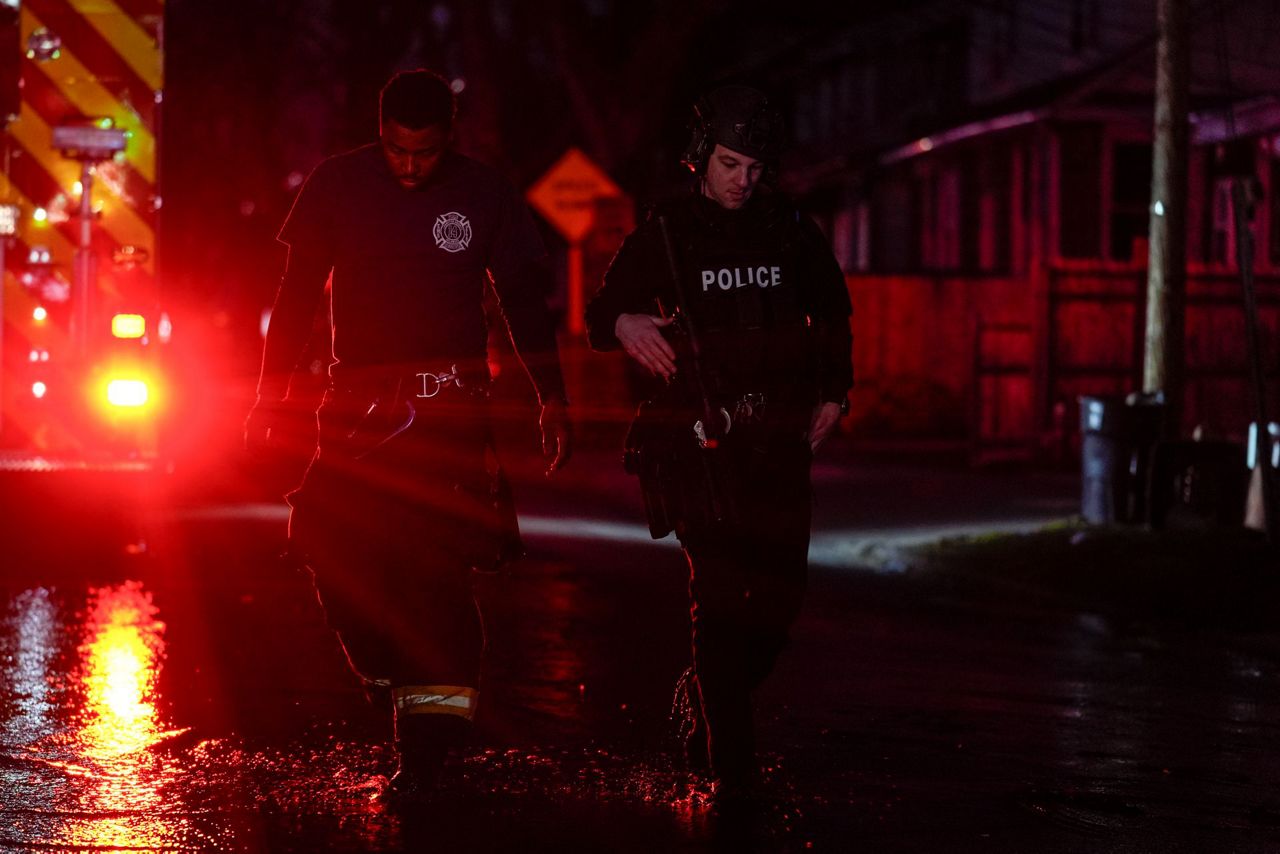 2 officers wounded by gunfire at home later seen on fire in ...