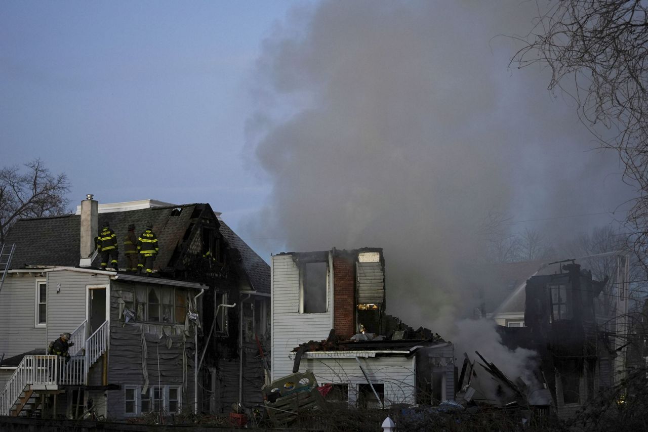 2 officers wounded by gunfire at home later seen on fire in ...