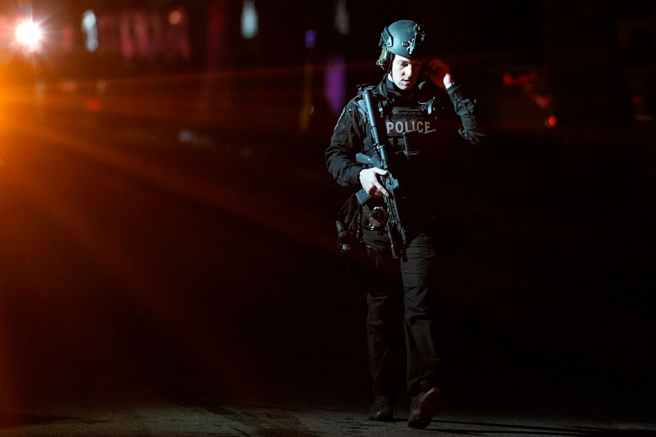 2 officers wounded by gunfire at home later seen on fire in ...