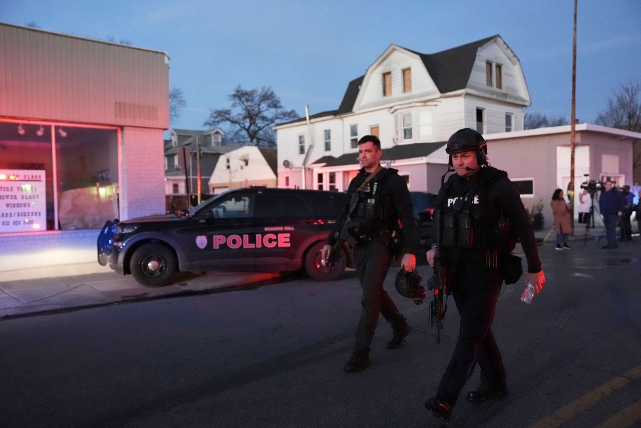 2 officers wounded by gunfire at home later seen on fire in ...