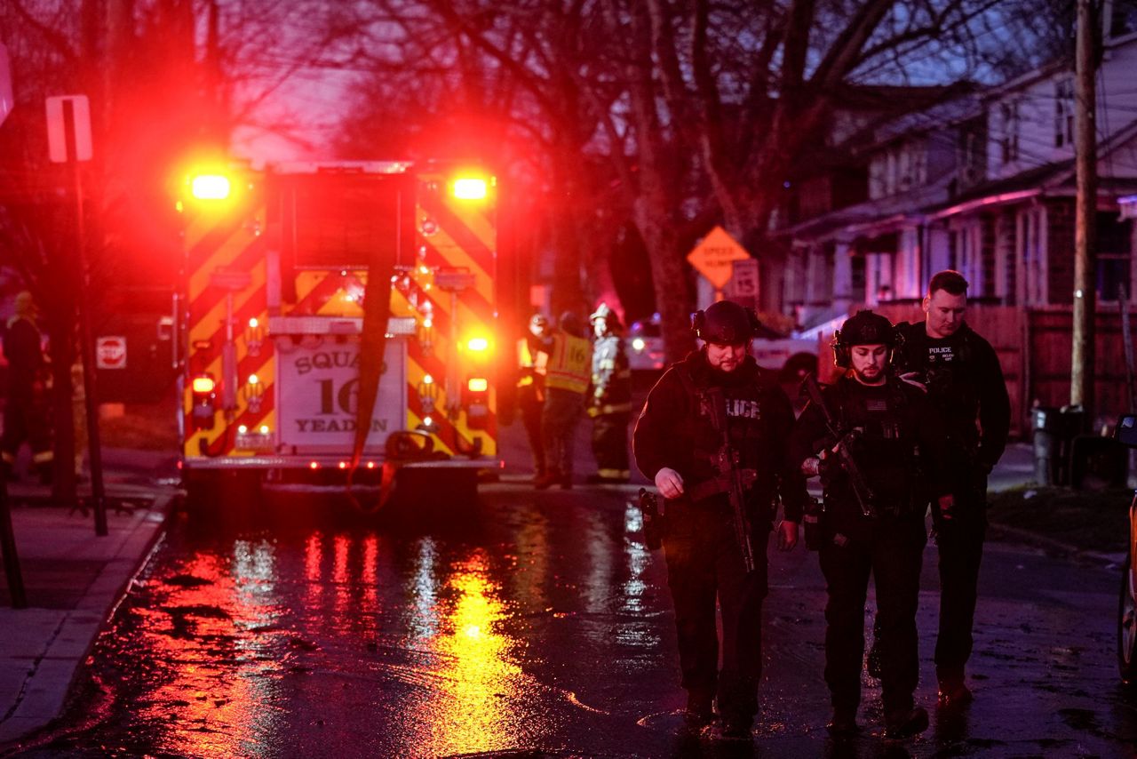 2 officers wounded by gunfire at home later seen on fire in ...