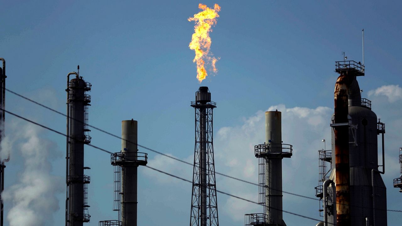 In this Aug. 31, 2017, file photo, a flame burns at the Shell Deer Park oil refinery in Deer Park, Texas. (AP Photo/Gregory Bull, File)