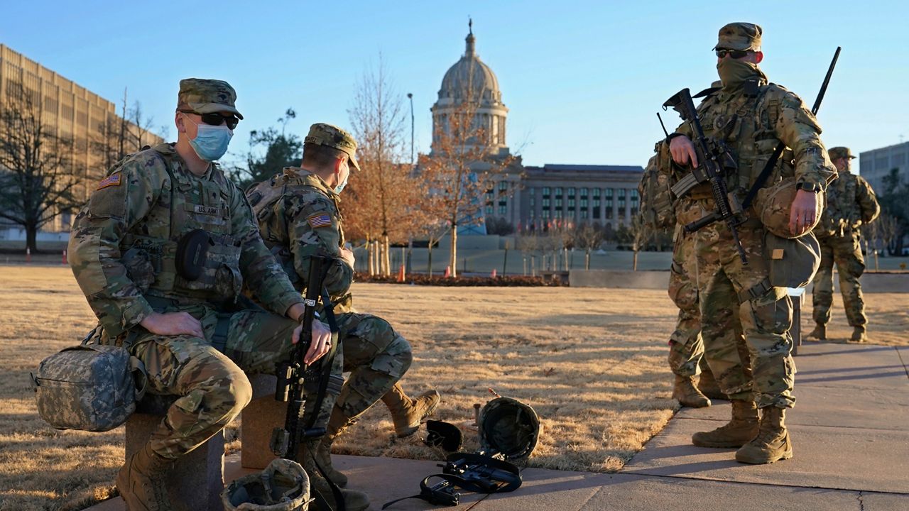 Oklahoma National Guard is stationed on the mostly empty grounds around the state Capitol Sunday, Jan. 17, 2021, in Oklahoma City. (AP Photo/Sue Ogrocki)