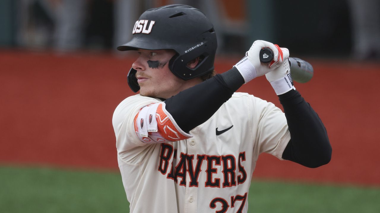 Oregon State infielder Travis Bazzana bats during an NCAA baseball game against Arizona State on April 6, 2024, in Corvallis, Ore. The Cleveland Guardians have the No. 1 overall pick in next week's draft. They have narrowed the talent pool to just a few possibilities with Oregon State second baseman Bazzana, Georgia outfielder/third baseman Charlie Condon and West Virginia middle infielder Wetherholt believed to be the frontrunning options. (AP Photo/Amanda Loman, File)