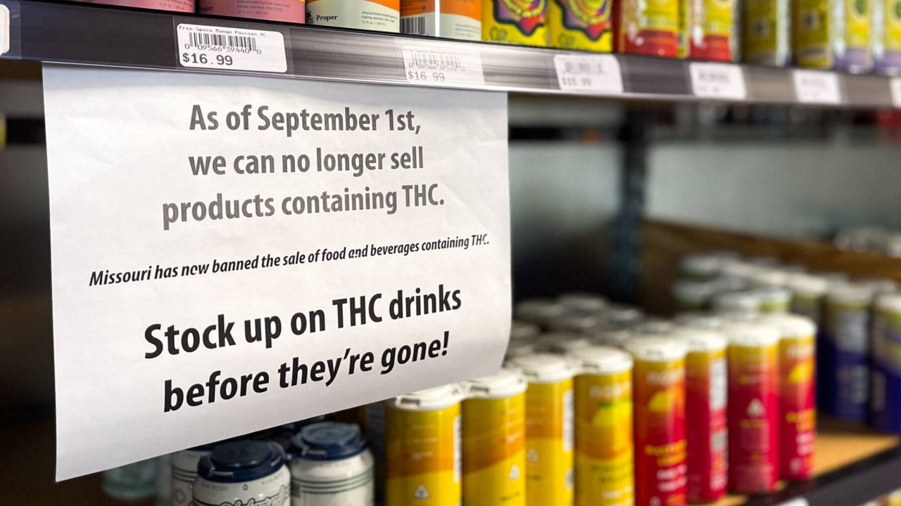 A St. Louis liquor store hung a sign announcing Gov. Mike Parson’s executive order to ban intoxicating hemp beverages (Rebecca Rivas/Missouri Independent).