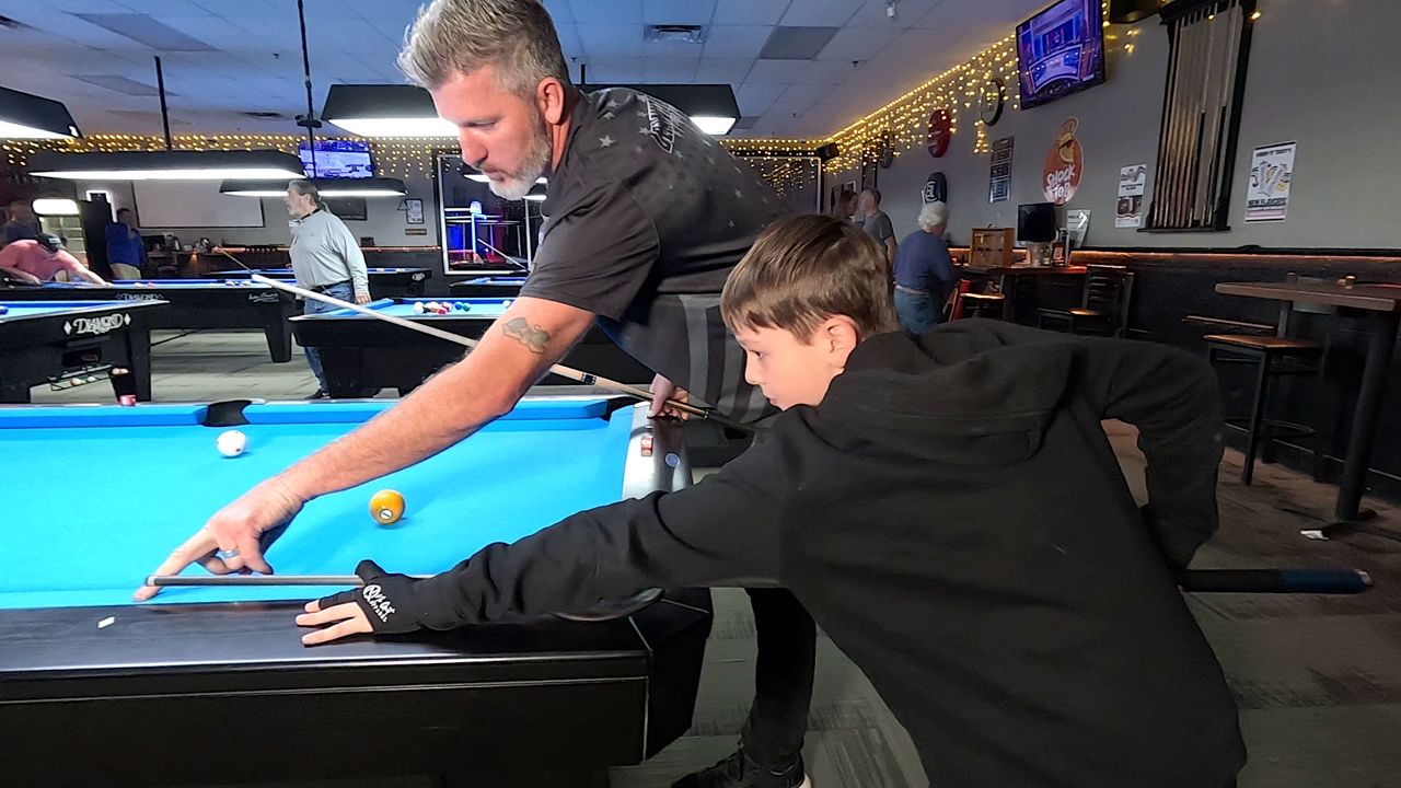 Pro pool player teaches winning shots at Sanford pool hall