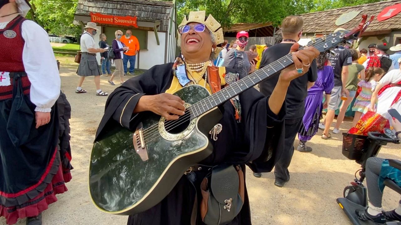 Pictured is 68-year-old Dallas resident Leza Mesiah performing for the lines of visitors attending the Scarborough Renaissance Festival located in Waxahachie, Texas. (Credit, Lupe Zapata)