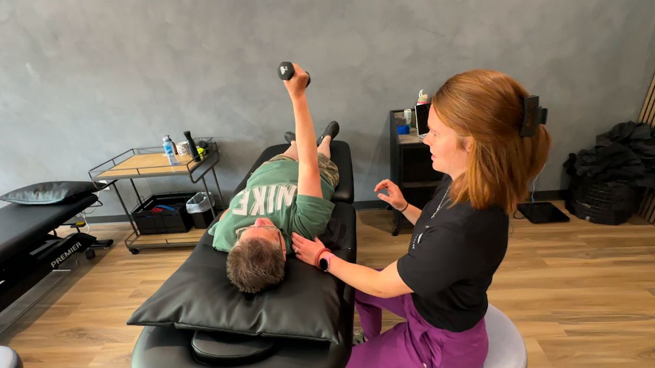 A physical therapist works with a patient at Paramount Performance Physical Therapy & Training in Suamico, Wisconsin.