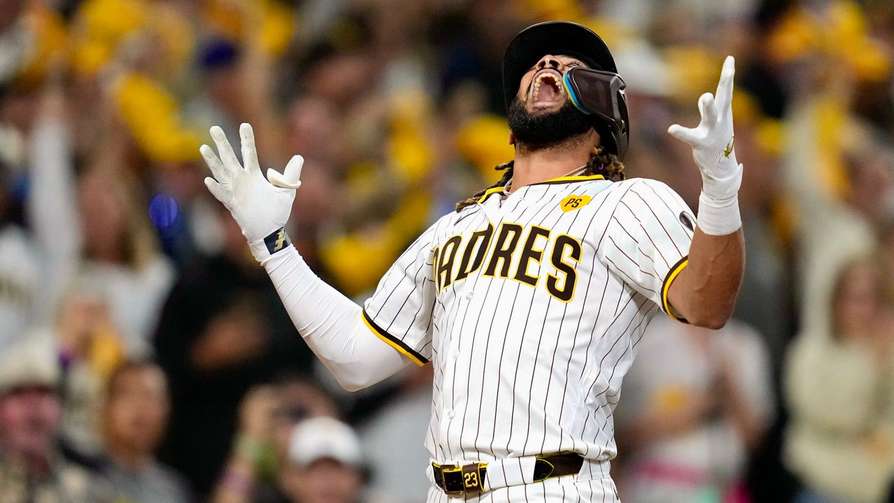 San Diego Padres' Fernando Tatis Jr. celebrates after hitting a two-run home run during the second inning in Game 3 of a baseball NL Division Series against the Los Angeles Dodgers, Tuesday, Oct. 8, 2024, in San Diego. (AP Photo/Ashley Landis)