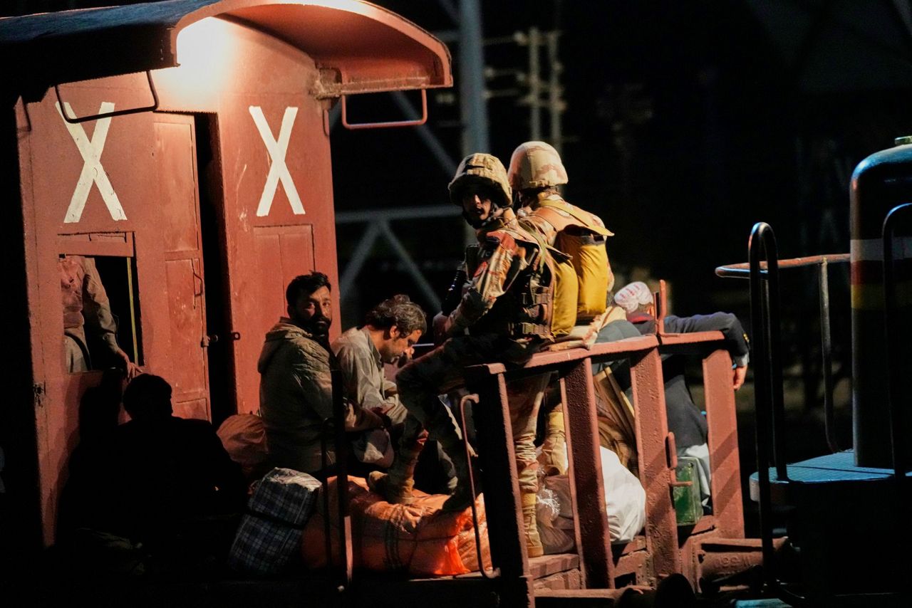 Pakistani security forces battle to free about 300 hostages aboard a ...
