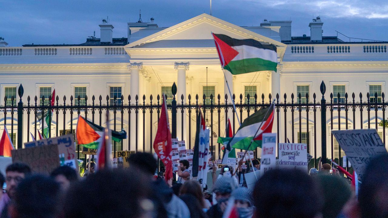 Anti-war activists protest outside of The White House during a pro-Palestinian demonstration asking for a cease-fire in Gaza in Washington, Saturday, Nov. 4, 2023. (AP Photo/Jose Luis Magana)