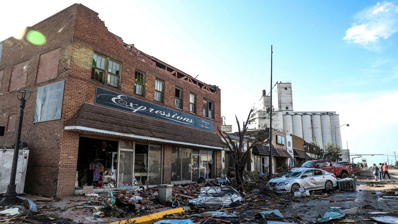 Buildings and vehicles show damage after a tornado struck Perryton, Texas, Thursday, June 15, 2023. (AP Photo/David Erickson)