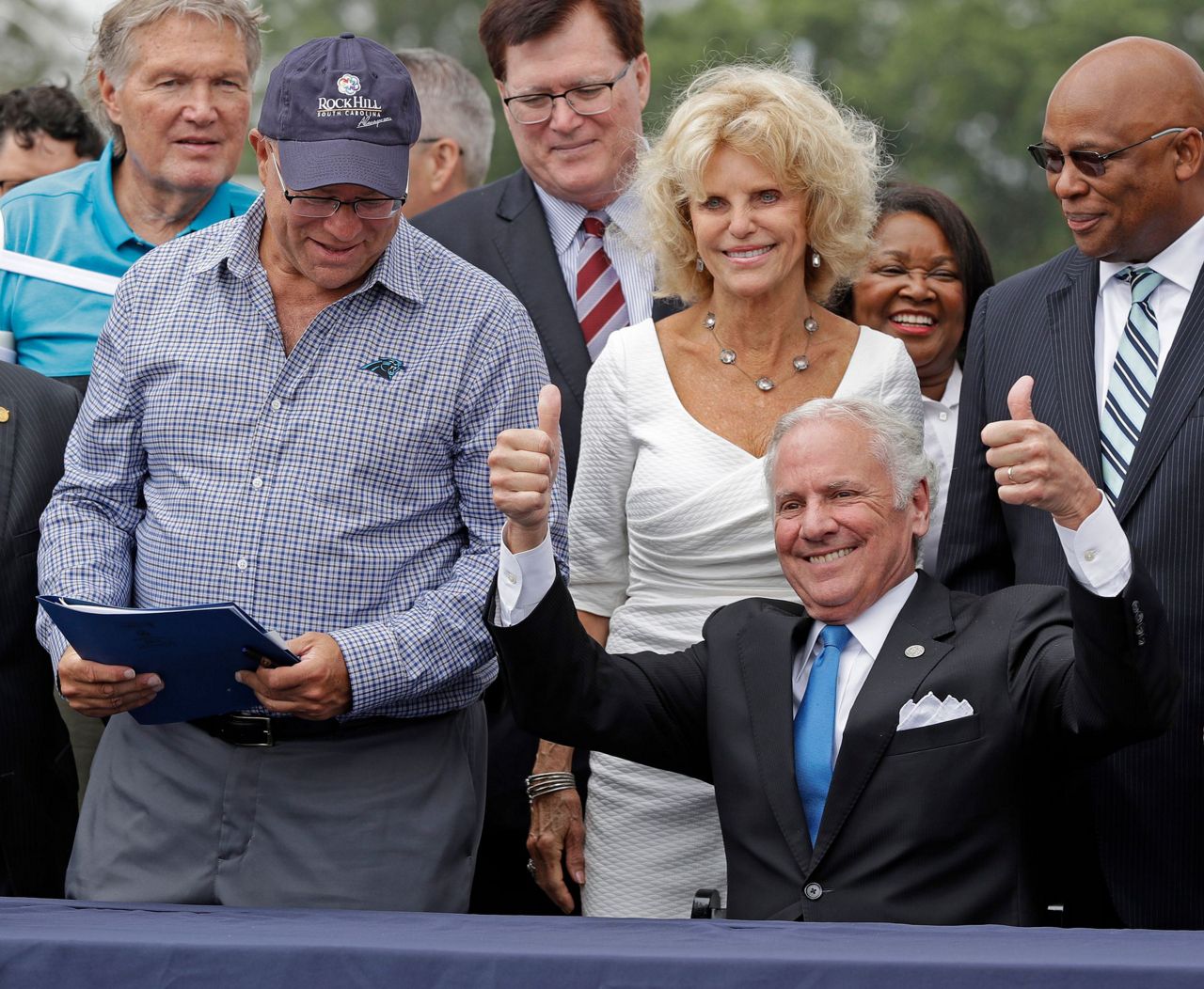 South Carolina Gov. Henry McMaster puts on a Carolina Panthers hat