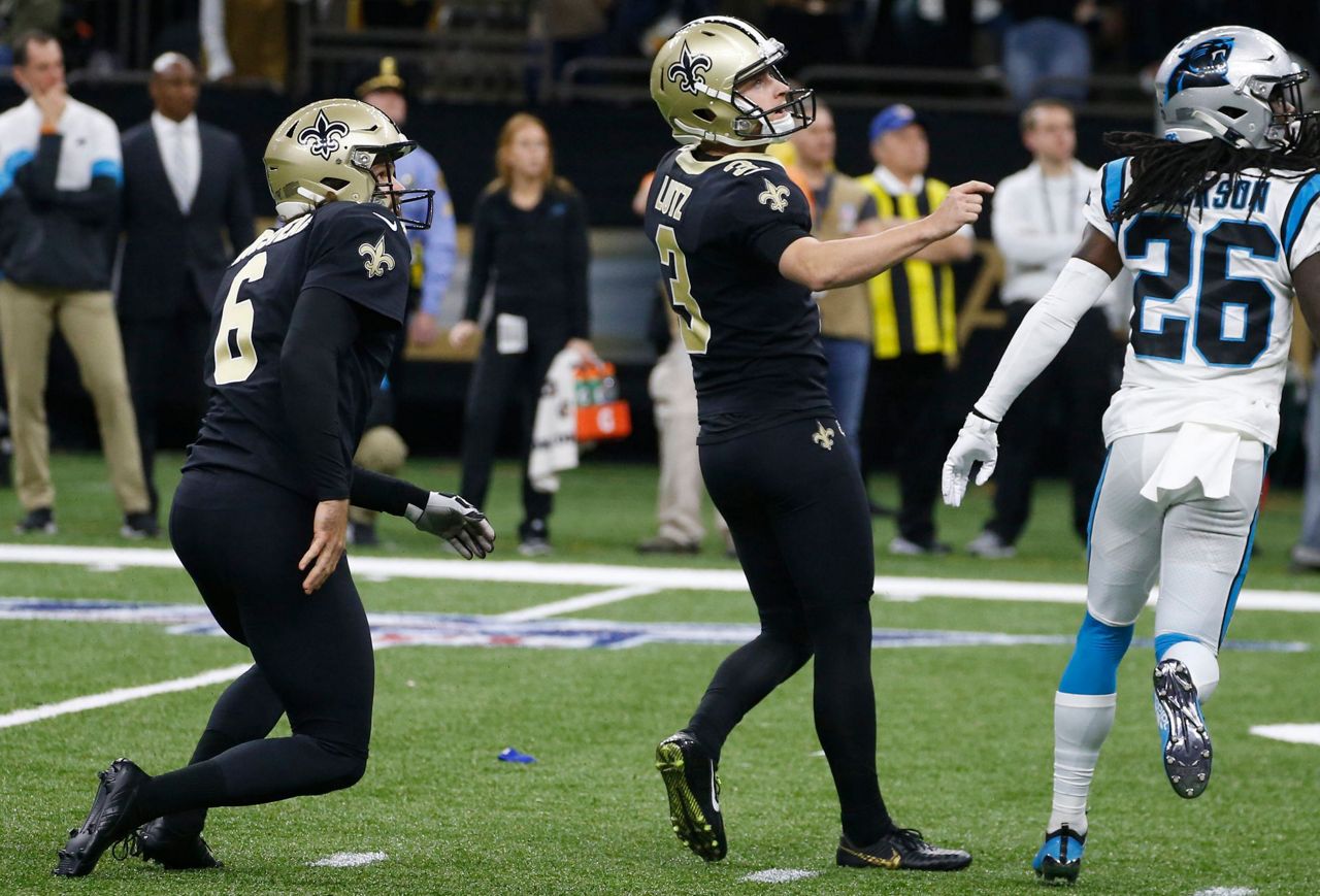 Carolina Panthers linebacker Thomas Davis lifts the NFC