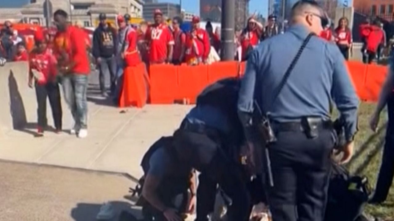 Police are seen detaining a person during the Kansas City parade shooting.(Photo: Screenshot from video provided by Alyssa Marsh Contreras)