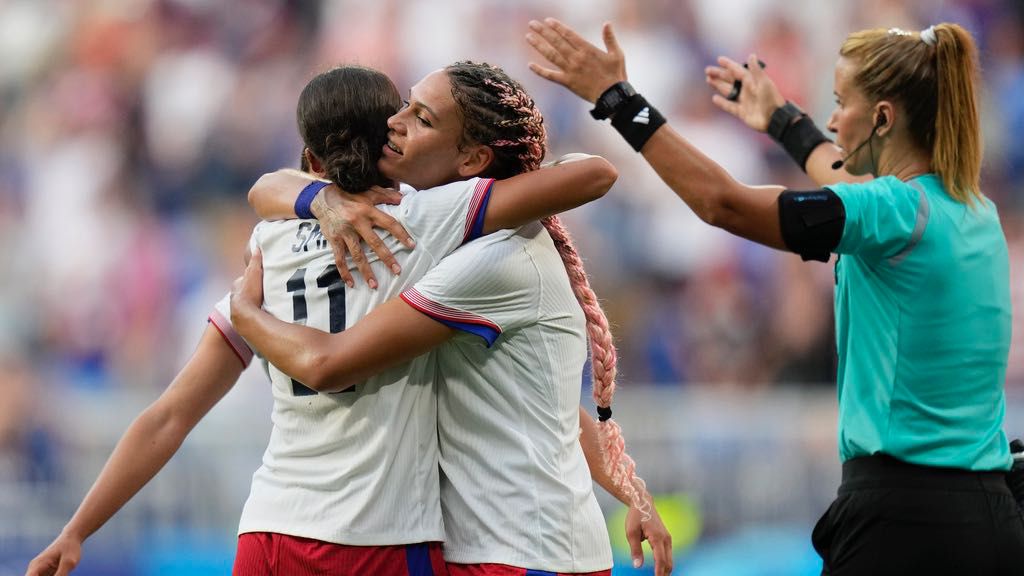 United States' Sophia Smith celebrates with Trinity Rodman the opening goal during a women's semifinal soccer match between the United States and Germany at the 2024 Summer Olympics, Tuesday, Aug. 6, 2024, at Lyon Stadium in Decines, France. (AP Photo/Silvia Izquierdo)