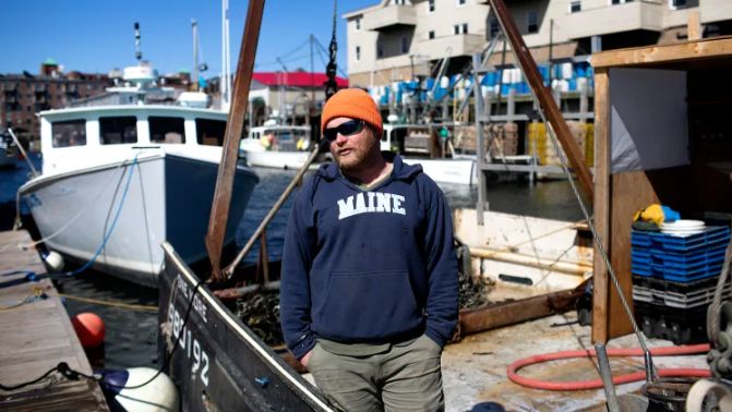 Henry MacVane, of Long Island, on his boat, One More, after a day of scallop fishing on Tuesday. McVane, who is also a lobsterman, said he is worried that new reporting requirements will force him to give up competitive information about where and how he fishes. (Portland Press Herald/Derek Davis)