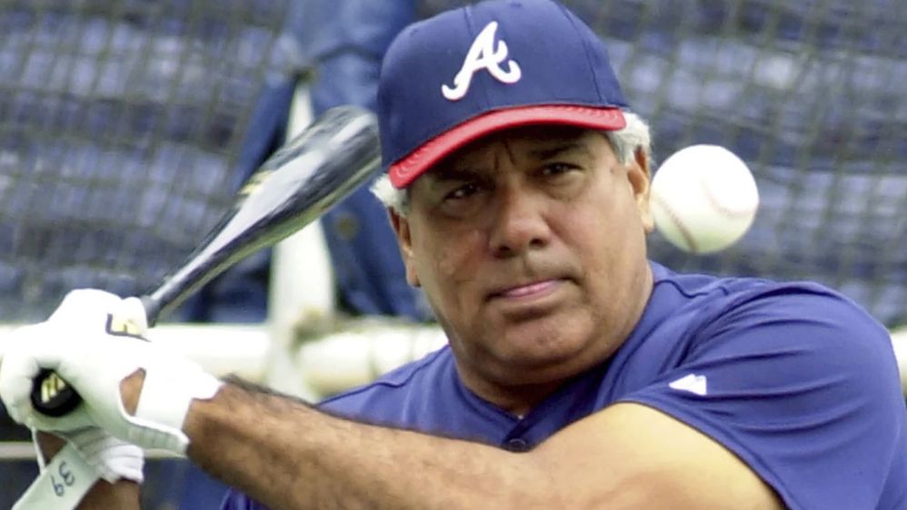 Atlanta Braves coach Pat Corrales hits ground balls during batting practice Oct. 11, 2001, at Turner Field in Atlanta. Corrales, who managed the Texas Rangers, Cleveland Indians and Philadelphia Phillies before a long stint on the Braves coaching staff under Hall of Fame skipper Bobby Cox, has died at age of 82. (AP Photo/Ric Feld, File)